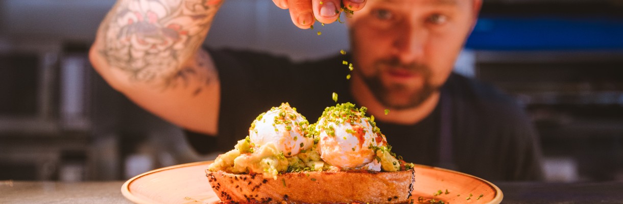 Chef finishing a dish at The Garlic Farm restaurant